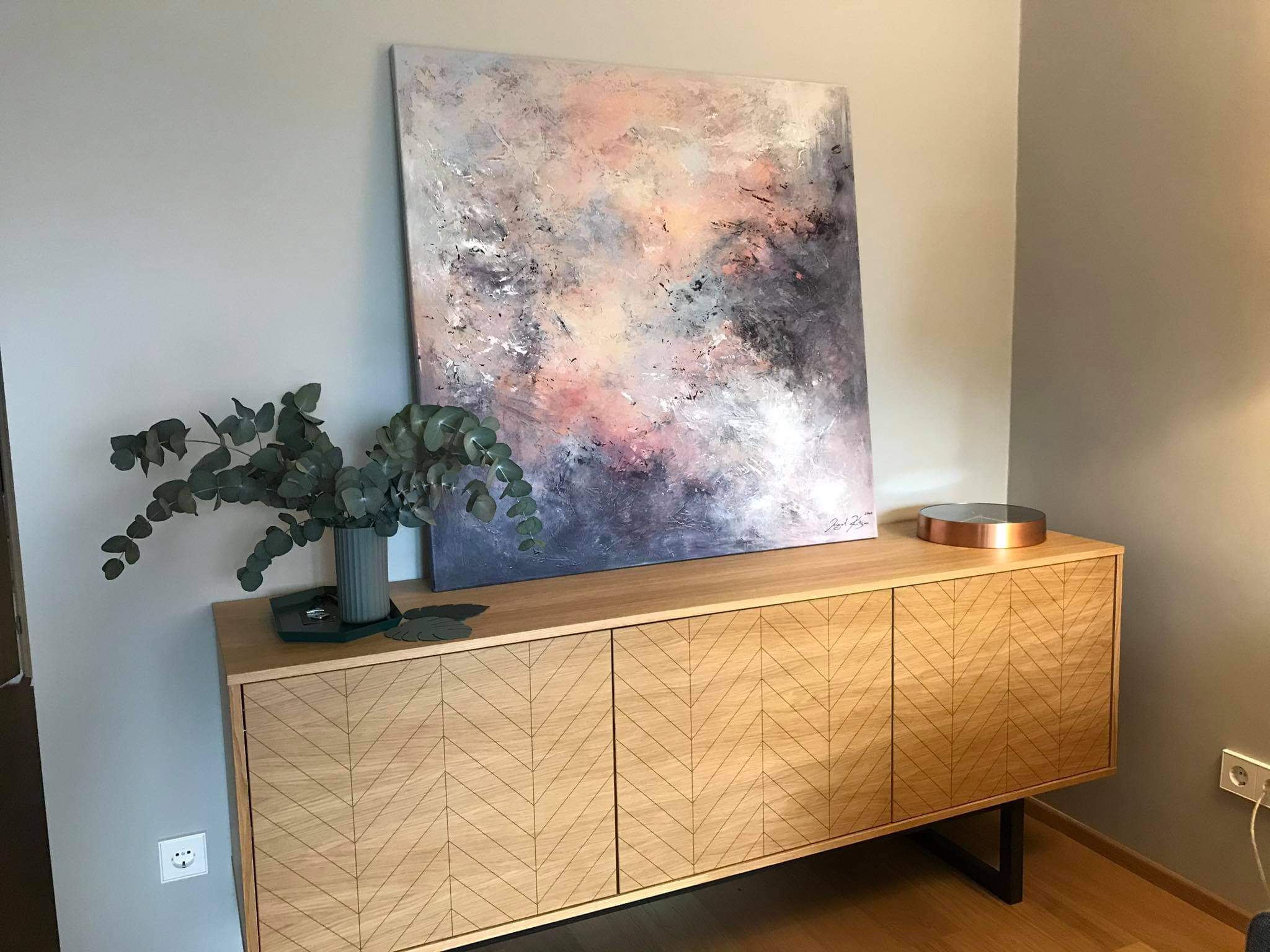 Ingel Kutsar's abstract original painting "Morning Glow" on the wall in an interior