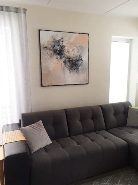 Ingel Kutsar's abstract original painting "Flood of emotions II" on the wall in an interior