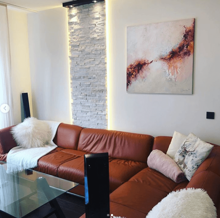 Ingel Kutsar's abstract original painting "Intoxicated by joy" on the wall in an interior