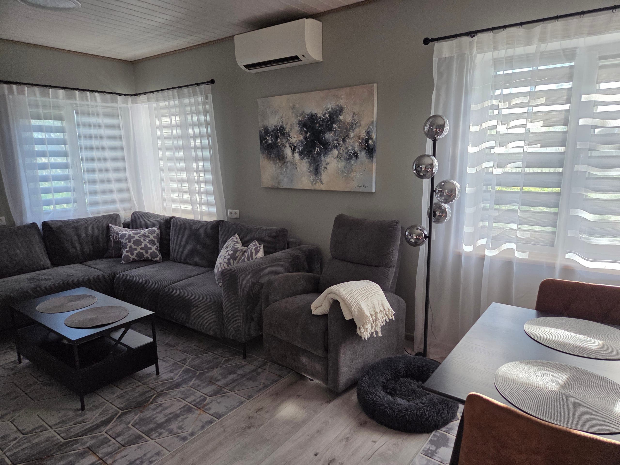 Ingel Kutsar's abstract original painting "When stars align" on the wall in an interior
